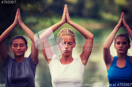 Image of women meditating and doing yoga exercise