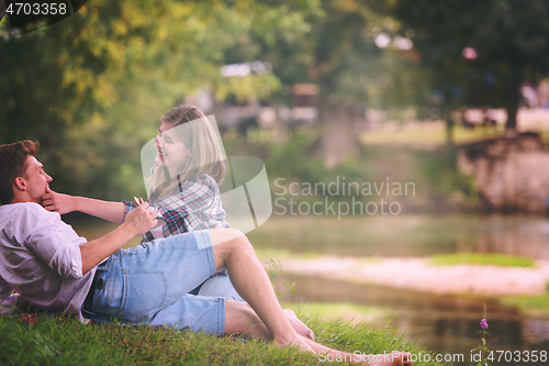 Image of Couple in love enjoying picnic time