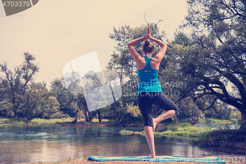 Image of woman meditating and doing yoga exercise