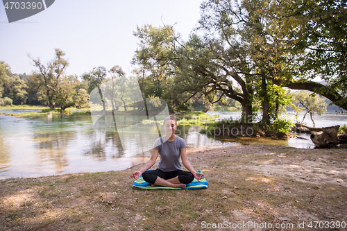 Image of woman meditating and doing yoga exercise