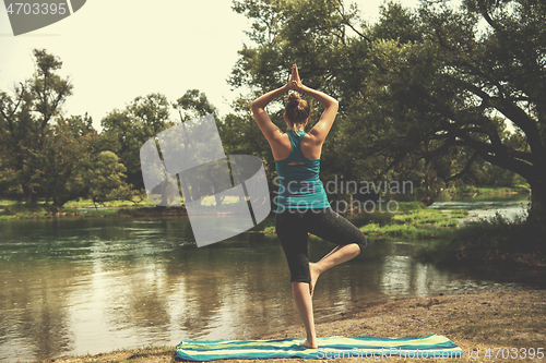 Image of woman meditating and doing yoga exercise