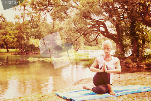 Image of woman meditating and doing yoga exercise