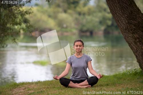 Image of woman meditating and doing yoga exercise