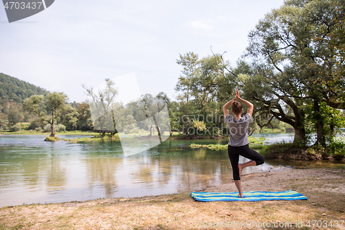 Image of woman meditating and doing yoga exercise