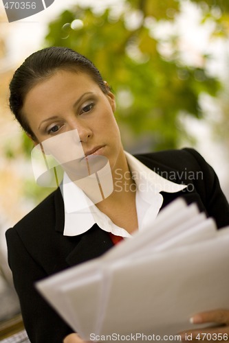 Image of attractive businesswoman with documents