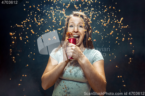 Image of Woman drinking a cola