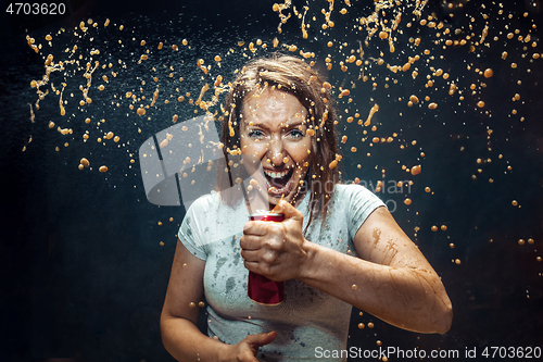 Image of Woman drinking a cola