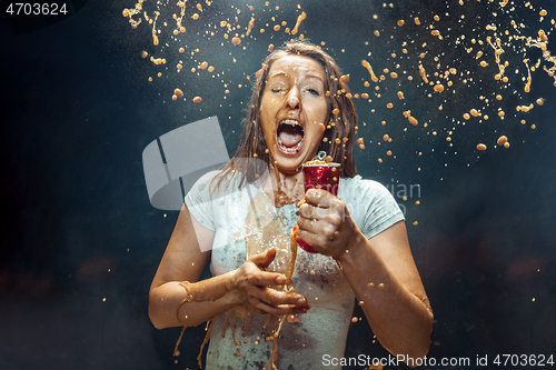 Image of Woman drinking a cola