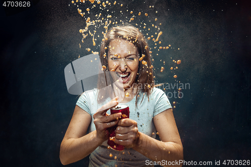 Image of Woman drinking a cola