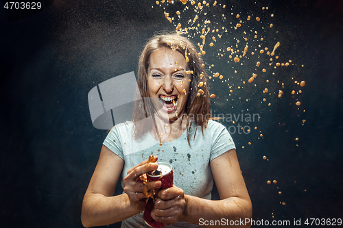 Image of Woman drinking a cola