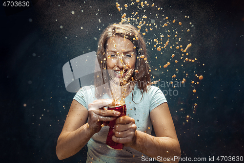 Image of Woman drinking a cola