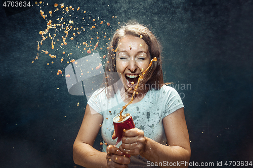 Image of Woman drinking a cola