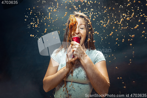 Image of Woman drinking a cola