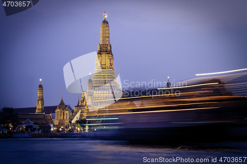 Image of Wat Arun, The Temple of Dawn, at twilight, view across Chao Phraya river. Bangkok, Thailand