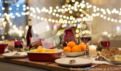 Image of food and drinks on christmas table at home