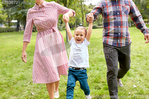 Image of happy family having fun at summer park