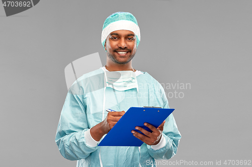 Image of indian male doctor or surgeon with clipboard