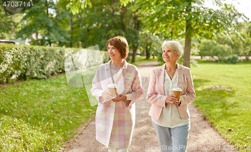 Image of senior women or friends drinking coffee at park