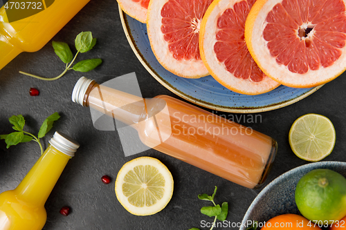 Image of glass bottles of fruit and vegetable juices