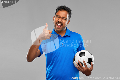 Image of football fan with soccer ball showing thumbs up
