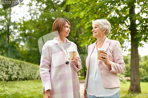 Image of senior women or friends drinking coffee at park