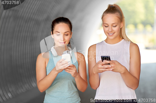 Image of women or female friends with smartphones