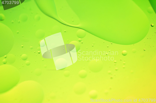 Image of Green and yellow abstract background picture made with oil, water and soap