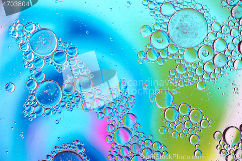 Image of Defocused multicolored abstract background picture made with oil, water and soap with mooving boubbles