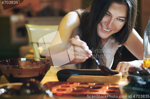 Image of Staying at home woman preparing handmade vegetarian chocolate tr