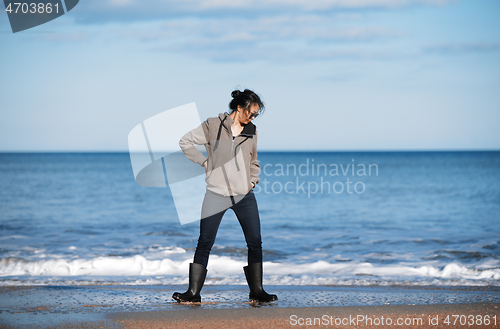 Image of Happy woman having fun at the ocean