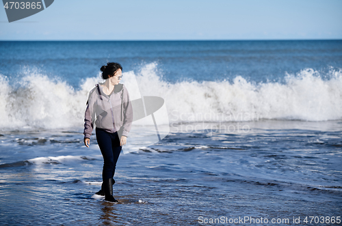 Image of Happy woman having fun at the ocean