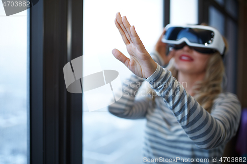 Image of Woman wearing Virtual reality headset