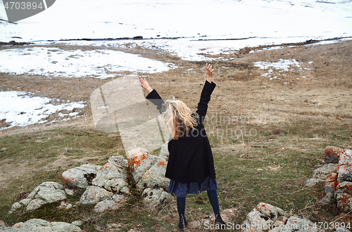 Image of Happy woman in the winter landscape