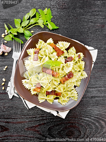 Image of Farfalle with pesto and bacon on board top