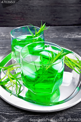 Image of Lemonade Tarragon with ice in two glasses on black board