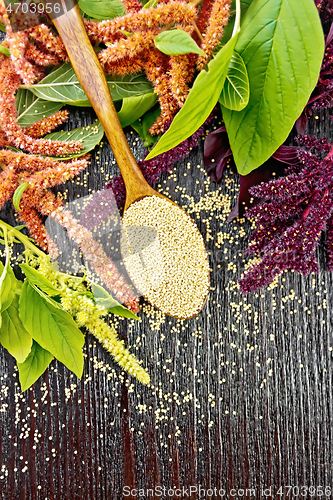 Image of Amaranth groats in spoon on dark board top