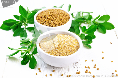 Image of Fenugreek in two bowls with leaves on white board