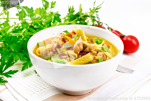 Image of Soup with mung and noodles in bowl on white board