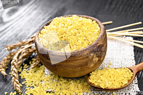 Image of Bulgur in bowl on black board