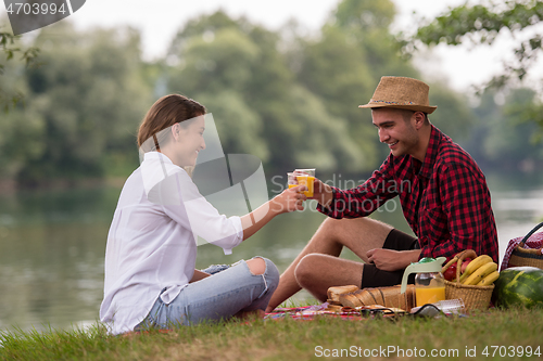 Image of Couple in love enjoying picnic time