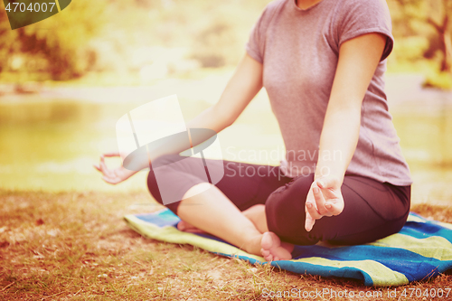 Image of woman meditating and doing yoga exercise