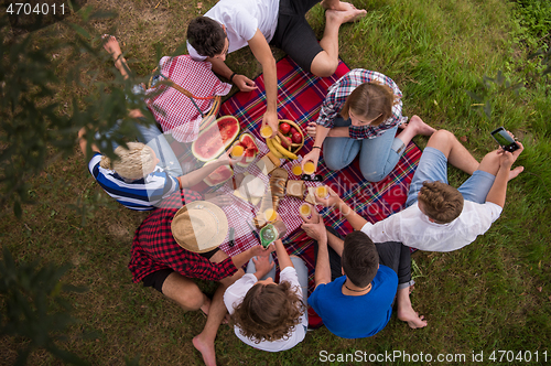 Image of top view of group friends enjoying picnic time