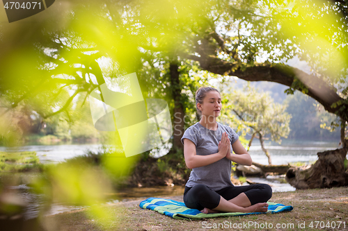 Image of woman meditating and doing yoga exercise