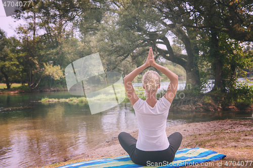 Image of woman meditating and doing yoga exercise