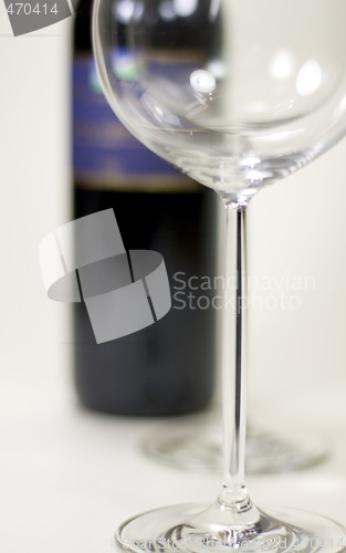 Image of red wine glasses and bottle