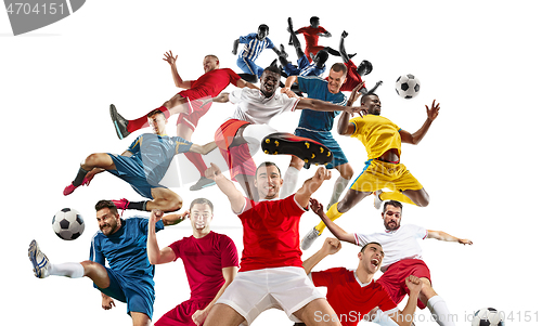 Image of Professional men - football soccer players with ball isolated wh