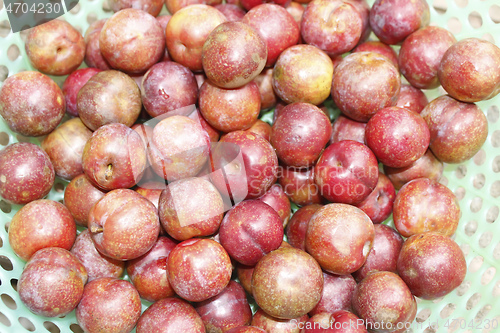 Image of ripe plums on plate