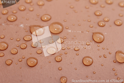 Image of dew on a red background