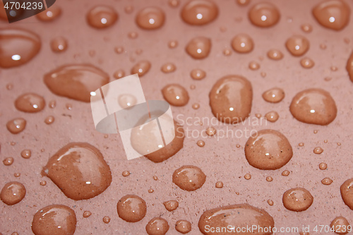 Image of dew on a red background