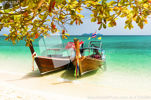 Image of Traditional wooden long tail boats on a picture perfect tropical beach near Phuket, Thailand, Asia